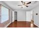 This bedroom features hardwood floors, light gray walls, and a ceiling fan at 844 Oak Nw St, Atlanta, GA 30318
