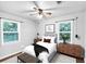 This well lit bedroom features sleek furniture and hardwood floors at 844 Oak Nw St, Atlanta, GA 30318