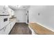 Galley kitchen features white cabinets, a contrasting countertop, and durable flooring at 844 Oak Nw St, Atlanta, GA 30318