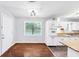 Bright kitchen features white cabinets and wood countertops, complemented by hardwood floors and natural light at 844 Oak Nw St, Atlanta, GA 30318
