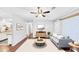 Cozy living room with hardwood floors, modern furniture, and an open layout to the kitchen at 844 Oak Nw St, Atlanta, GA 30318