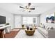 Cozy living room with hardwood floors, a ceiling fan, and stylish furniture arrangement at 844 Oak Nw St, Atlanta, GA 30318