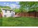 Spacious backyard featuring a modern wooden deck and privacy fence, offering a serene outdoor space at 308 Mcpherson Se Pl, Atlanta, GA 30316