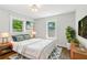 Cozy bedroom features a comfortable bed, bedside tables, and stylish decor for a relaxing ambiance at 308 Mcpherson Se Pl, Atlanta, GA 30316