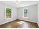 Bright bedroom with hardwood floors and ample natural light streaming through the windows at 308 Mcpherson Se Pl, Atlanta, GA 30316