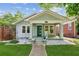 Charming home featuring a welcoming front porch, manicured lawn, and beautifully landscaped front yard at 308 Mcpherson Se Pl, Atlanta, GA 30316