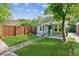 Well-maintained home showcasing a lush front yard with a walkway leading to a quaint covered porch at 308 Mcpherson Se Pl, Atlanta, GA 30316
