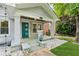 Charming front porch with teal door, stone accents, and manicured landscaping enhance curb appeal at 308 Mcpherson Se Pl, Atlanta, GA 30316