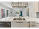 Modern kitchen featuring white countertops and stainless steel appliances with an open view to the living room at 308 Mcpherson Se Pl, Atlanta, GA 30316