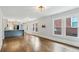 Open living space with hardwood floors flowing into a modern kitchen, offering seamless entertaining at 308 Mcpherson Se Pl, Atlanta, GA 30316