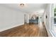 Spacious living room with hardwood floors leading to a modern kitchen, perfect for entertaining at 308 Mcpherson Se Pl, Atlanta, GA 30316