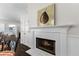 Dining room featuring a fireplace, hardwood floors, and bright trim at 3335 Ashton Dr, Suwanee, GA 30024
