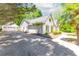 Charming home with painted brick, manicured landscaping, and a detached garage at 3335 Ashton Dr, Suwanee, GA 30024