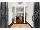 Grand foyer with hardwood floors and decorative iron entry doors at 3335 Ashton Dr, Suwanee, GA 30024