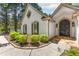 Home exterior with manicured shrubbery and a stone walkway at 3335 Ashton Dr, Suwanee, GA 30024