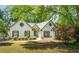Charming home boasts manicured landscaping and classic architectural details at 3335 Ashton Dr, Suwanee, GA 30024
