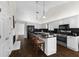 Bright kitchen features granite countertops, stainless steel appliances, and a functional center island with seating at 3335 Ashton Dr, Suwanee, GA 30024