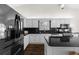 Well-lit kitchen with granite counters, a center island, stainless steel appliances, and white cabinets at 3335 Ashton Dr, Suwanee, GA 30024