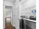 Laundry room with modern stainless steel appliances and wire shelving for optimal organization at 3335 Ashton Dr, Suwanee, GA 30024