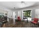 Bright living area featuring hardwood floors, large windows, and a view to the backyard at 3335 Ashton Dr, Suwanee, GA 30024