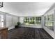 Sunroom with tile flooring and an abundance of natural light from the surrounding windows at 3335 Ashton Dr, Suwanee, GA 30024