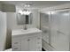 Bathroom featuring modern vanity with a sleek countertop and a glass-enclosed shower at 3445 Huntington Ct, Douglasville, GA 30134