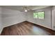 Bright and airy bedroom featuring stylish ceiling fan and hardwood flooring at 3445 Huntington Ct, Douglasville, GA 30134