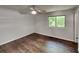 Bright and airy bedroom featuring a ceiling fan and hardwood flooring at 3445 Huntington Ct, Douglasville, GA 30134