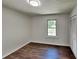Bedroom with a window, closet, and hardwood flooring at 3445 Huntington Ct, Douglasville, GA 30134