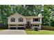 Charming split-level home featuring a two-car garage and a well-maintained front yard at 3445 Huntington Ct, Douglasville, GA 30134