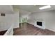 Open-concept living room with a fireplace, vaulted ceilings, and ample natural light at 3445 Huntington Ct, Douglasville, GA 30134