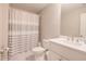 Clean bathroom with a shower and tub combination with a gray and white striped shower curtain at 3611 Ridgeway Rd, Duluth, GA 30096
