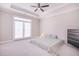 Spacious carpeted bedroom with ceiling fan, balcony door, and furniture at 3611 Ridgeway Rd, Duluth, GA 30096