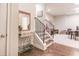 Inviting entryway with hardwood floors, staircase, decorative mirror, and stylish accents at 3611 Ridgeway Rd, Duluth, GA 30096