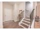 Charming entryway with hardwood floors, staircase with black iron railing, and neutral decor at 3611 Ridgeway Rd, Duluth, GA 30096