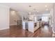 Open concept kitchen with center island, modern appliances, and hardwood flooring at 3611 Ridgeway Rd, Duluth, GA 30096