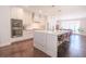 Gourmet kitchen with stainless steel appliances, a large island, and an adjacent dining area with lots of light at 3611 Ridgeway Rd, Duluth, GA 30096