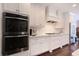 Modern kitchen featuring stainless steel appliances, white cabinets, and a subway tile backsplash at 3611 Ridgeway Rd, Duluth, GA 30096