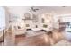 Bright living room with built-in shelving, fireplace, hardwood floors, and open flow to the kitchen at 3611 Ridgeway Rd, Duluth, GA 30096