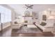 Comfortable living area with built-in shelving, fireplace, hardwood floors, and an open flow to the kitchen at 3611 Ridgeway Rd, Duluth, GA 30096