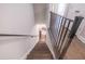 View of a staircase with wood treads and iron railing leading to the lower level of the house at 3611 Ridgeway Rd, Duluth, GA 30096