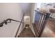 Staircase with dark hardwood steps and railings, leading to the living area at 3611 Ridgeway Rd, Duluth, GA 30096