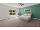 Bedroom with a queen size bed, a ceiling fan, and natural light from two windows at 435 Webb Dr, Norcross, GA 30071