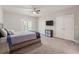 Bedroom with carpet floors, ceiling fan, and closet with double doors at 435 Webb Dr, Norcross, GA 30071