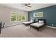 Large bedroom with two twin beds, a ceiling fan, and natural light from large windows at 435 Webb Dr, Norcross, GA 30071