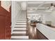 Welcoming foyer featuring a staircase and an open view of the kitchen and dining area at 435 Webb Dr, Norcross, GA 30071