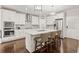 Modern kitchen with white cabinets, marble countertops, stainless steel appliances and a kitchen island at 435 Webb Dr, Norcross, GA 30071
