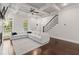 Bright living room with fireplace, coffered ceilings and a staircase at 435 Webb Dr, Norcross, GA 30071