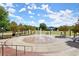 A park area featuring an interactive water feature, benches, gazebos, and mature landscaping at 435 Webb Dr, Norcross, GA 30071