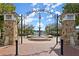 Picturesque park entrance with stone pillars, ornamental gate, fountain, and landscaped surroundings offers a serene retreat at 435 Webb Dr, Norcross, GA 30071
